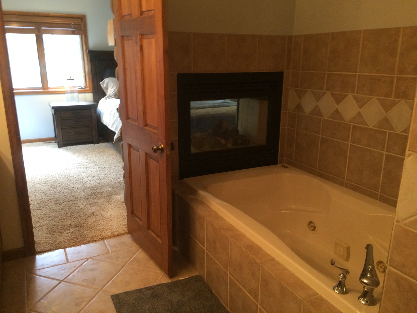 Private Jacuzzi tub in main floor master bathroom Private Jacuzzi tub in main floor master bathroom